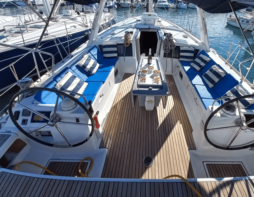 Barcelona: 2-Hour Sailboat Tour with Snacks and Drinks - The first glide: Port Vell, mega-yachts, Maremagnum, and Columbus