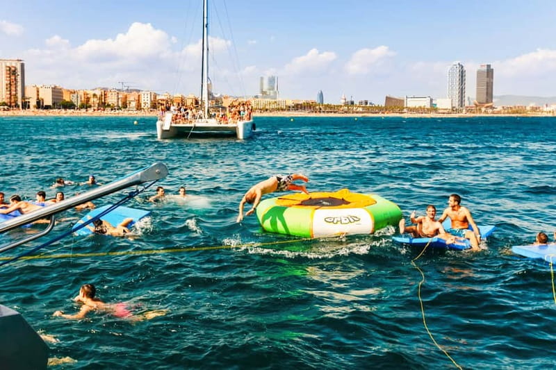 Barcelona: Catamaran Party Cruise with BBQ Meal - The Mediterranean Swim Stop: The Moment That Changes Everything
