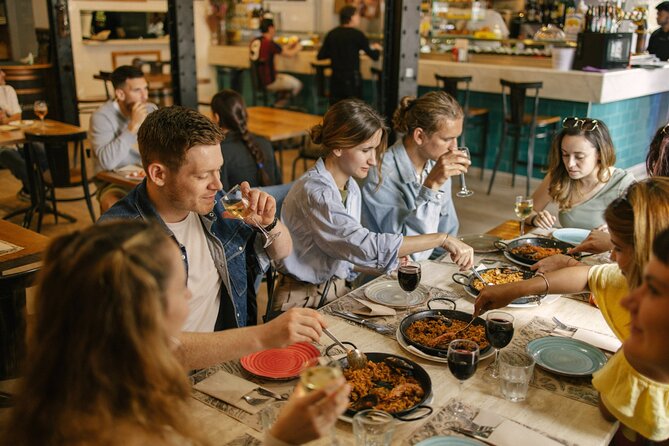 Barcelona: Guided Food Walking Tour with Tapas and Wine - Stop 3 near the port in Carrer de la Mercè: a family bodega with sailor-style snacks