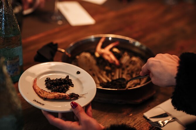 Barcelona: Guided Food Walking Tour with Tapas and Wine - Stop 8 in Carrer d’Avinyó: the paella finale with cava and a dessert finish