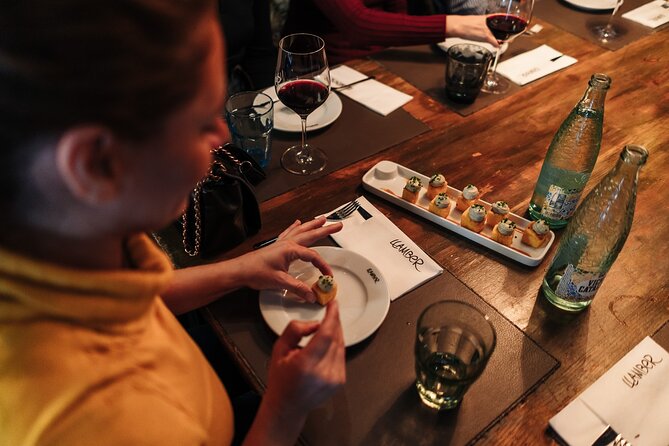 Barcelona: Guided Food Walking Tour with Tapas and Wine - Stop 2 in Carrer Ample: Catalan classics with paired wine