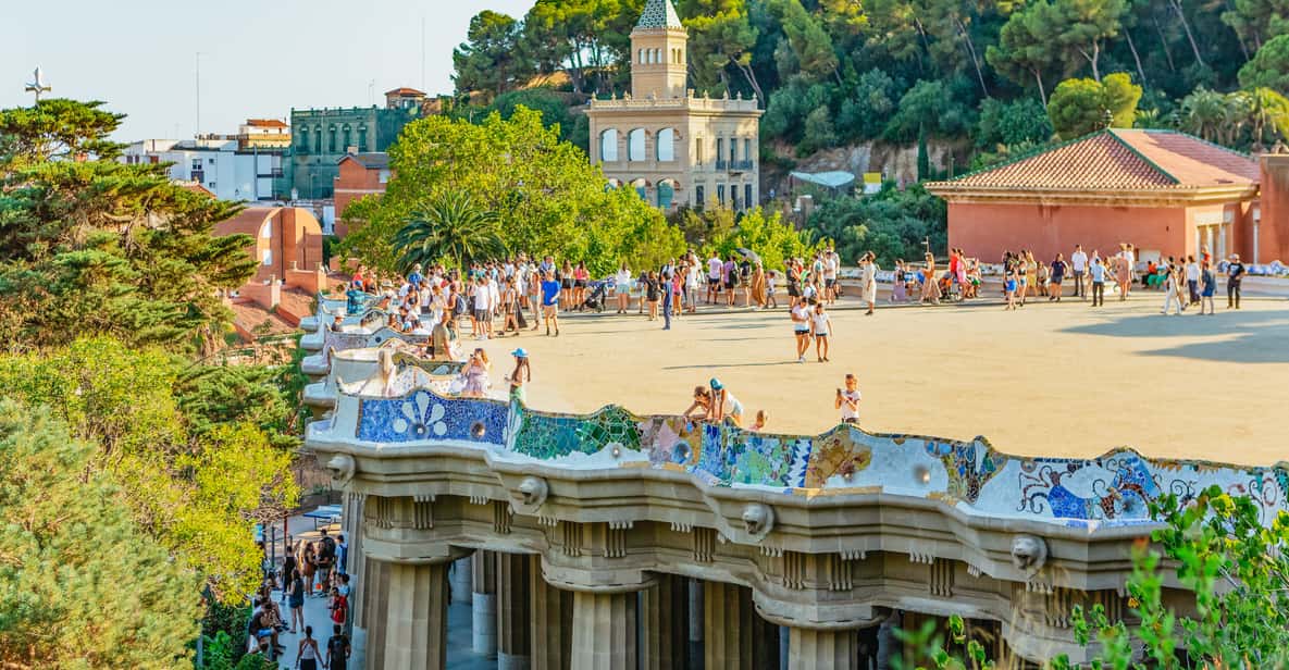 Barcelona: Park Güell Guided Tour & Priority Access - Monumental Zone walkthrough: Doric columns, vaulted paths, and trencadís craft