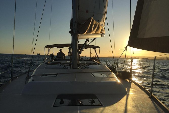 Barcelona Sunset Cruise with Light Snacks and Open Bar - Small-boat reality: comfort, music, and motion
