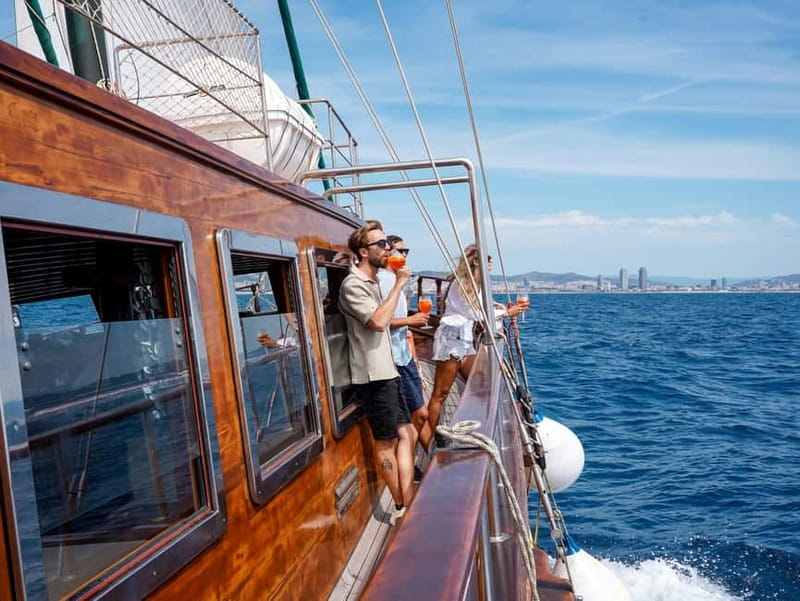 Barcelona: Wooden Boat Sailing with Tapa and Welcome Drink - Crew and Atmosphere: Helpful, Friendly, and Photo-Ready