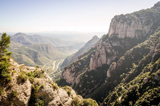 Premium Montserrat & Wine Full Day Tour from Barcelona - Oller del Mas lunch: Catalan meal, castle-winery atmosphere, and wine education